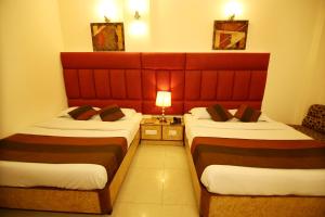 Postel nebo postele na pokoji v ubytování Hotel Parkway Deluxe