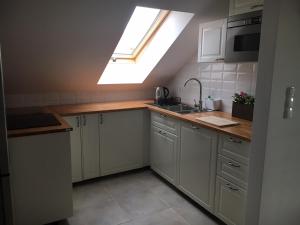 Kuchyňa alebo kuchynka v ubytovaní Apartamenty Baltic