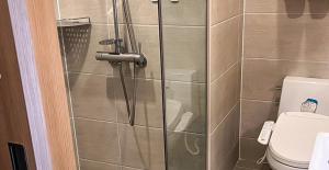 a shower in a bathroom with a toilet at Busan CONNECT Ocean Hotel in Busan +28 photos