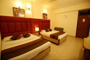 Postel nebo postele na pokoji v ubytování Hotel Parkway Deluxe