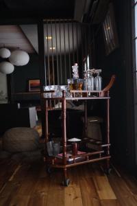 a food cart with dishes on it in a room at Sugi Crossroads in Myoko