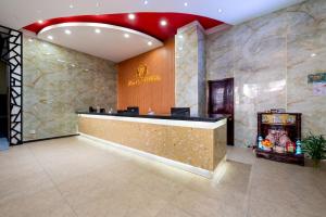 a lobby of a hotel with a reception desk at Happy Light Central Nha Trang in Nha Trang +88 photos