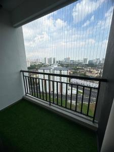 a balcony with a view of a city at Botaniqa Residence in Puchong