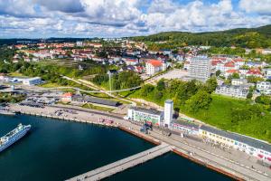 an aerial view of a city next to the water at RÜGEN-HOTEL mit Ostseeblick in Sassnitz