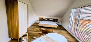 a bedroom with a bed and a dog laying on the floor at Schöne Wohnung in Walenstadt in Walenstadt