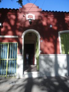 The facade or entrance of Casa Pueblo Hostel