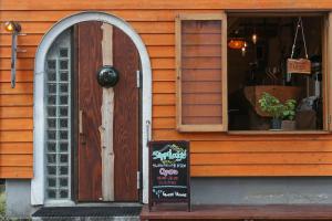 a store with a sign in front of a door at SappoLodge in Sapporo