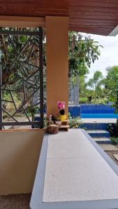 a walkway in a house with flowers on it at Pool of Siloam with tiny house in Bangad