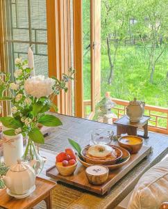 a table with plates and bowls of food on it at 응정헌 in Seoul