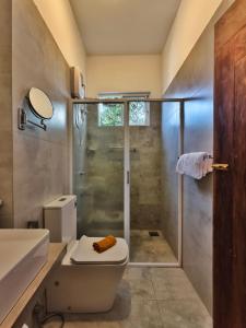 a bathroom with a shower and a toilet and a sink at Mervins & Indus Residence in Colombo +52 photos