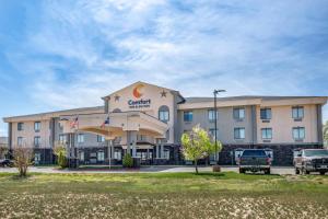 a hotel with cars parked in front of it at Comfort Inn & Suites Lubbock West in Lubbock