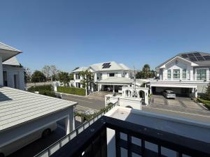 a view from a balcony of some houses at Luxury house for rent near Suvarnabhumi Airport in Sathani Lat Krabang