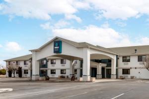 a large white building with a sign on it at Clarion Pointe Prescott Valley in Prescott Valley
