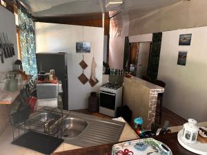 a kitchen with a sink and a stove at Kukuriaz Fare in Bora Bora