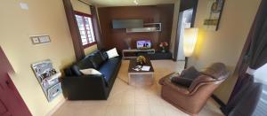 A television and/or entertainment centre at Residential Majada Apartments