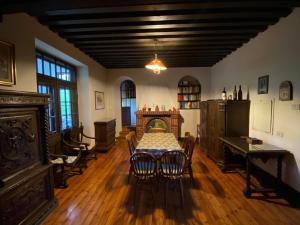 a dining room with a table and a fireplace at Ca' Il Guscio in Cortina dʼAmpezzo