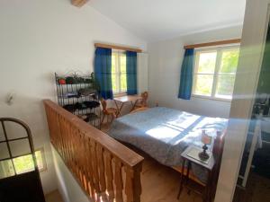 a bedroom with a bed and a table and chairs at Ca' Il Guscio in Cortina dʼAmpezzo +17 photos