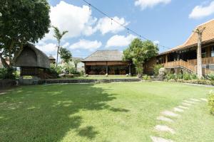 an empty yard in front of a building at Natajiwa Village, close to Canggu and Seminyak in Seminyak