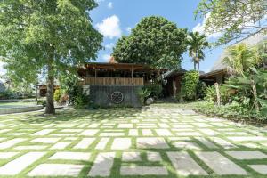 a courtyard with a building in the background at Natajiwa Village, close to Canggu and Seminyak in Seminyak