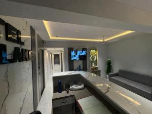a large bathroom with a tub in a room at Hotel Pine Lake in Ahmedabad