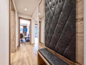 a hallway with a bench in a house at Farmhouse in Schwendau with Ski Storage in Hippach