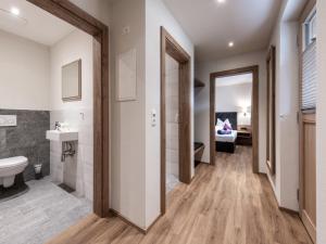 a bathroom with a toilet and a sink at Farmhouse in Schwendau with Ski Storage in Hippach +82 photos