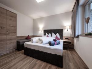 a bedroom with a large bed in a room at Farmhouse in Schwendau with Ski Storage in Hippach