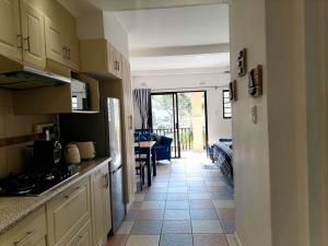 a kitchen with a view of a dining room at Crayfish Inn No.4 in Ramsgate