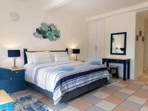 a bedroom with a large bed and a table at Crayfish Inn No.4 in Ramsgate