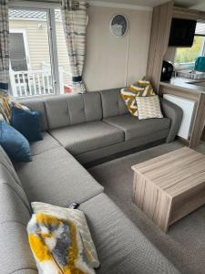a living room with a couch and a coffee table at S & S Retreat in Heysham