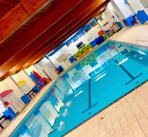 a large swimming pool with a pool at S & S Retreat in Heysham