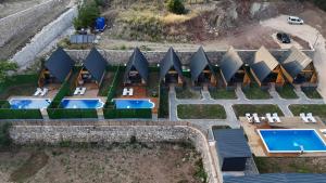 an aerial view of a resort with a swimming pool at Evergreen Lodge in Çakırlar +10 photos