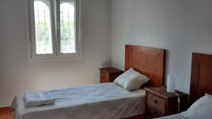 Łóżko lub łóżka w pokoju w obiekcie Casita Andaluza
