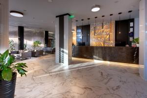 a lobby of a hotel with a reception desk at Best Western PLUS Premium Inn in Sunny Beach +103 photos
