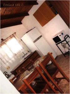 an overhead view of a kitchen with a stove and refrigerator at Cabañas La Paloma in La Paloma