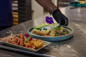 a counter with two plates of food on a table at Elevate Ella Resort & Spa in Ella
