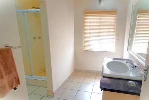 a bathroom with a sink and a shower at Donkin House in Beaufort West +59 photos