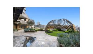 a garden with a dome in the middle of a building at Spencer on Rock in Melbourne