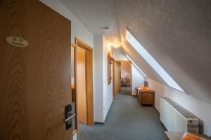 a room with a hallway with a skylight at Gutshof Colmberg in Colmberg