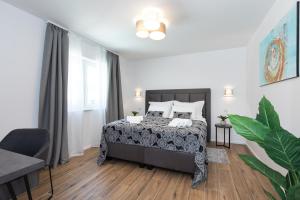 a bedroom with a bed and a large window at Villa Aurora in Baška +26 photos