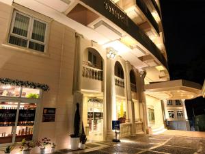 a store front of a building at night at Wright Park Hotel in Baguio