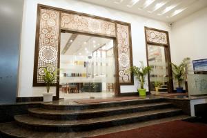 a lobby with stairs in front of a building at HOTEL RAH INN - Yog Nagari Rishikesh Railway Station in Rishīkesh