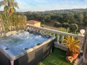 a hot tub on the balcony of a house at Chambre avec piscine, jacuzzi, vue mer et montagne, plage à pied in Roquebrune-sur-Argens +12 photos