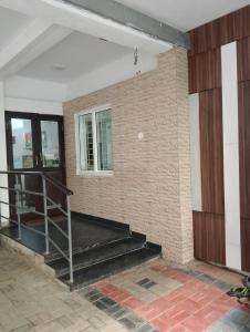 a room with a staircase in a building at VR Homes in Chennai