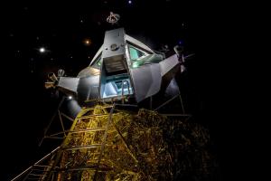 a space shuttle on top of a tower at night at Apollo11 in Collepietra