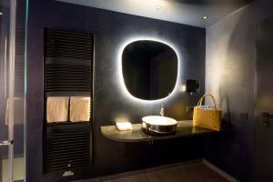 a bathroom with a sink and a mirror at Apollo11 in Collepietra