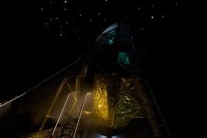 a person standing on top of a ship at night at Apollo11 in Collepietra +4 photos