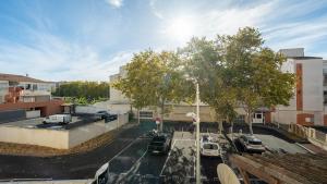 a view of a parking lot with cars parked at Le St Clair N208 ST2 in Agde