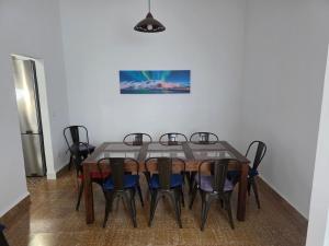 a dining room with a table and chairs at Casa Alvarez Tazacorte in Tazacorte +12 photos