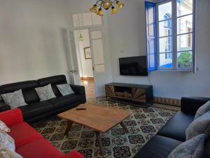 a living room with a couch and a coffee table at Casa Alvarez Tazacorte in Tazacorte